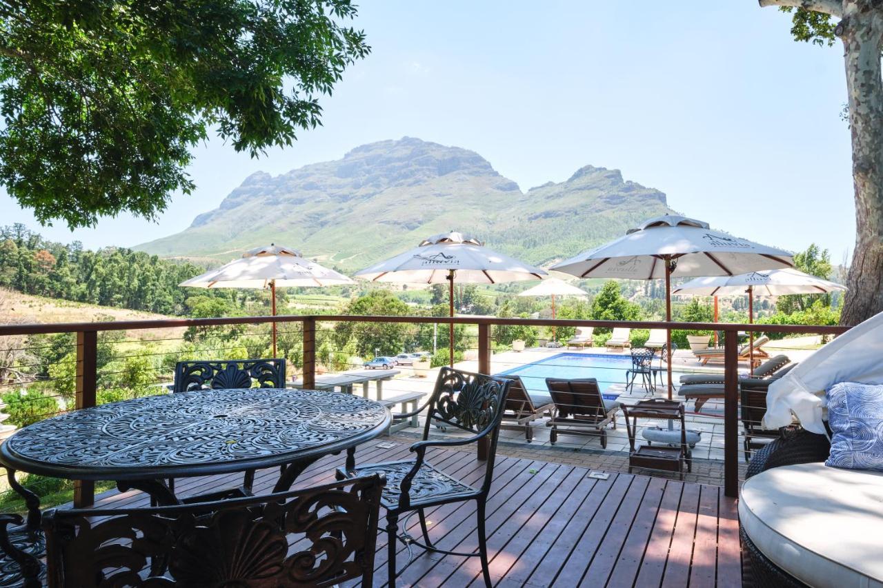 Alluvia Boutique Winery & Luxury Accommodation 斯泰伦博斯 外观 照片 View of the Three Sisters from the deck of the restaurant at the Boschendal Wine Estate